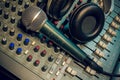 Microphone ,headphone on sound mixer background. Royalty Free Stock Photo