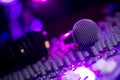 Microphone and Headphones on dirty sound mixer panel Royalty Free Stock Photo