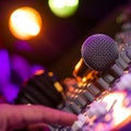 Microphone and Headphones on dirty sound mixer panel Royalty Free Stock Photo