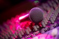 Microphone and Headphones on dirty sound mixer panel Royalty Free Stock Photo