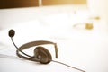 Microphone headsets on the table with computer keywords Royalty Free Stock Photo