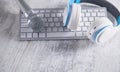 Microphone, keyboard and headphones on a white desk Royalty Free Stock Photo