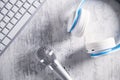 Microphone, keyboard and headphones on a white desk. Top View Royalty Free Stock Photo