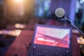 Microphone and laptop computer at podium on business seminar in conference room Royalty Free Stock Photo