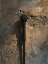 A microphone is leaning against a wall Royalty Free Stock Photo