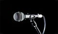 Microphone, mic, karaoke, concert, voice music. Closeup microphone. Vocal audio mic on a bleck background. Live music