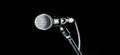 Microphone, mic, karaoke, concert, voice music. Closeup microphone. Vocal audio mic on a bleck background. Live music Royalty Free Stock Photo