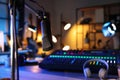 Microphone near table with professional mixing console in radio studio Royalty Free Stock Photo