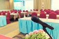 Microphone over the Abstract blurred photo of conference hall or seminar room with attendee background, Business meeting concept Royalty Free Stock Photo