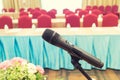 Microphone over the Abstract blurred photo of conference hall or seminar room with attendee background, Business meeting concept Royalty Free Stock Photo