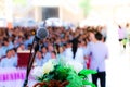 Microphone over the blurred business conference hall or seminar room, Blurred background. Royalty Free Stock Photo