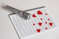 Microphone and paper red hearts are located on a clean music notebook. The concept of music and love. Valentine`s day Royalty Free Stock Photo