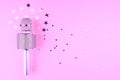 Microphone on a pink background with confetti. Royalty Free Stock Photo