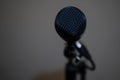 Microphone placed on stand with white background in a conference room Royalty Free Stock Photo