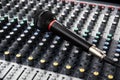 Microphone on a professional sound mixing console with adjusting Royalty Free Stock Photo