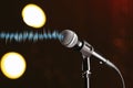 Microphone and radio wave on background, bokeh effect