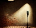 Microphone ready on stage against a brick wall ready for the Karaoke performer Royalty Free Stock Photo