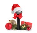 Microphone with Santa hat and decorations on white. Christmas music concept