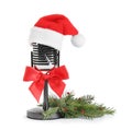 microphone with Santa hat isolated on white. Christmas music concept Royalty Free Stock Photo