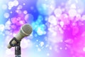 Microphone with Soft red green blue pink abstract background wit