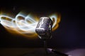 Microphone for sound, music, karaoke in audio studio or stage. Mic technology. Speech broadcast equipment. Microphone in dark room Royalty Free Stock Photo