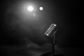 Microphone for sound, music, karaoke in audio studio or stage. Mic technology. Speech broadcast equipment. Microphone in dark room Royalty Free Stock Photo