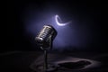 Microphone for sound, music, karaoke in audio studio or stage. Mic technology. Speech broadcast equipment. Microphone in dark room Royalty Free Stock Photo