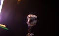 Microphone for sound, music, karaoke in audio studio or stage. Mic technology. Speech broadcast equipment. Microphone in dark room Royalty Free Stock Photo