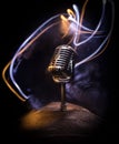 Microphone for sound, music, karaoke in audio studio or stage. Mic technology. Speech broadcast equipment. Microphone in dark room Royalty Free Stock Photo