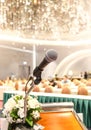 Microphone on the speech podium over the Abstract of conference