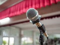Microphone on Stage Against a Background of Auditorium. Royalty Free Stock Photo
