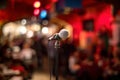Microphone on stage against a background of auditorium Royalty Free Stock Photo