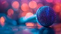 Microphone on stage with bokeh background, close-up Royalty Free Stock Photo