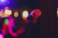 Microphone on stage in club with background. Royalty Free Stock Photo