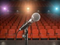 Microphone on the stage of concert hall or theater with red seat Royalty Free Stock Photo