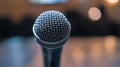 Microphone on stage in a conference room or recording studio, blurred background Royalty Free Stock Photo