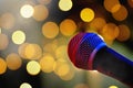 Microphone on stage with bokeh lights Royalty Free Stock Photo