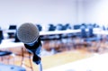 Microphone on stage of speech with copy space in computer classroom Royalty Free Stock Photo