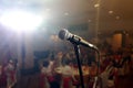 Microphone on stage under spotlight Royalty Free Stock Photo