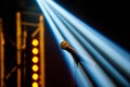 A microphone on a stand of a classic look in the light of the spotlights shot on a dark background Royalty Free Stock Photo