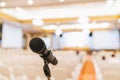 Microphone stand in conference hall blurred background with copy space. Public announcement event, Organization company meeting Royalty Free Stock Photo