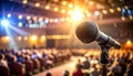 Microphone on Stand in Front of Blurred Audience and Stage Lights concert event Royalty Free Stock Photo