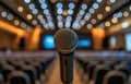 A microphone is on a stand in front of an empty auditorium Royalty Free Stock Photo