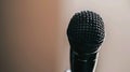 A microphone is on a stand in front of a keyboard. Royalty Free Stock Photo