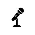 Microphone on stand icon black silhouette. Royalty Free Stock Photo