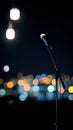 Microphone on Stand at Night with City Lights in Background Royalty Free Stock Photo