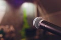 microphone on a stand up comedy stage with colorful bokeh , high contrast image. Royalty Free Stock Photo