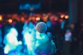 microphone on a stand up comedy stage with colorful bokeh , high contrast image. Royalty Free Stock Photo