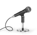 Microphone on the stand on a white background. Royalty Free Stock Photo