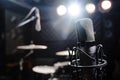 microphone in a studio with spot lights on background Royalty Free Stock Photo